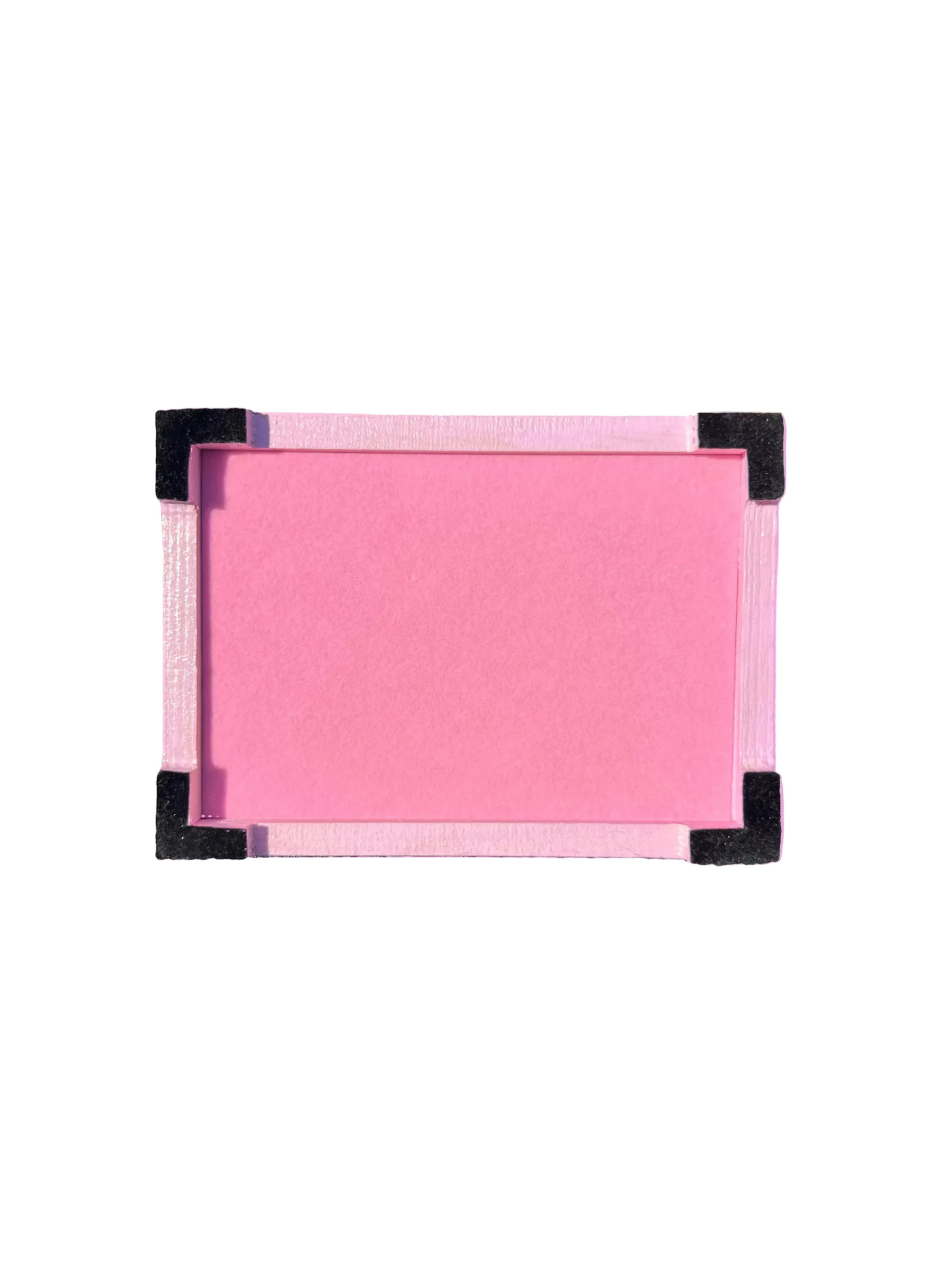 pink velvet on the bottom of the jewelry box with black velvet stoppers 